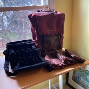 Tropicfeel burgundy backpack with custom pouches and internal hanging storage